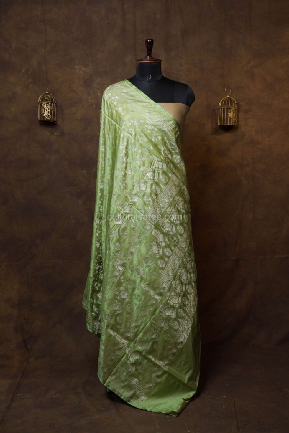 Pastel green banarasi jal silk saree with floral motifs