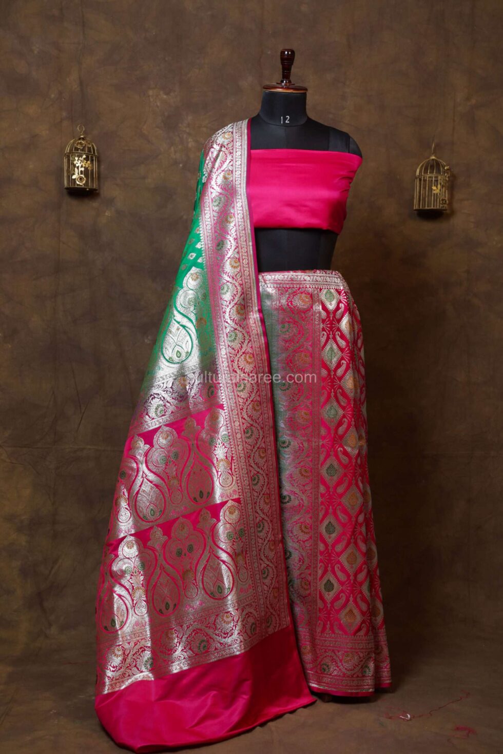 Green and pinkbanarasi satan saree with minakari work and floral buta motifs on achal and border