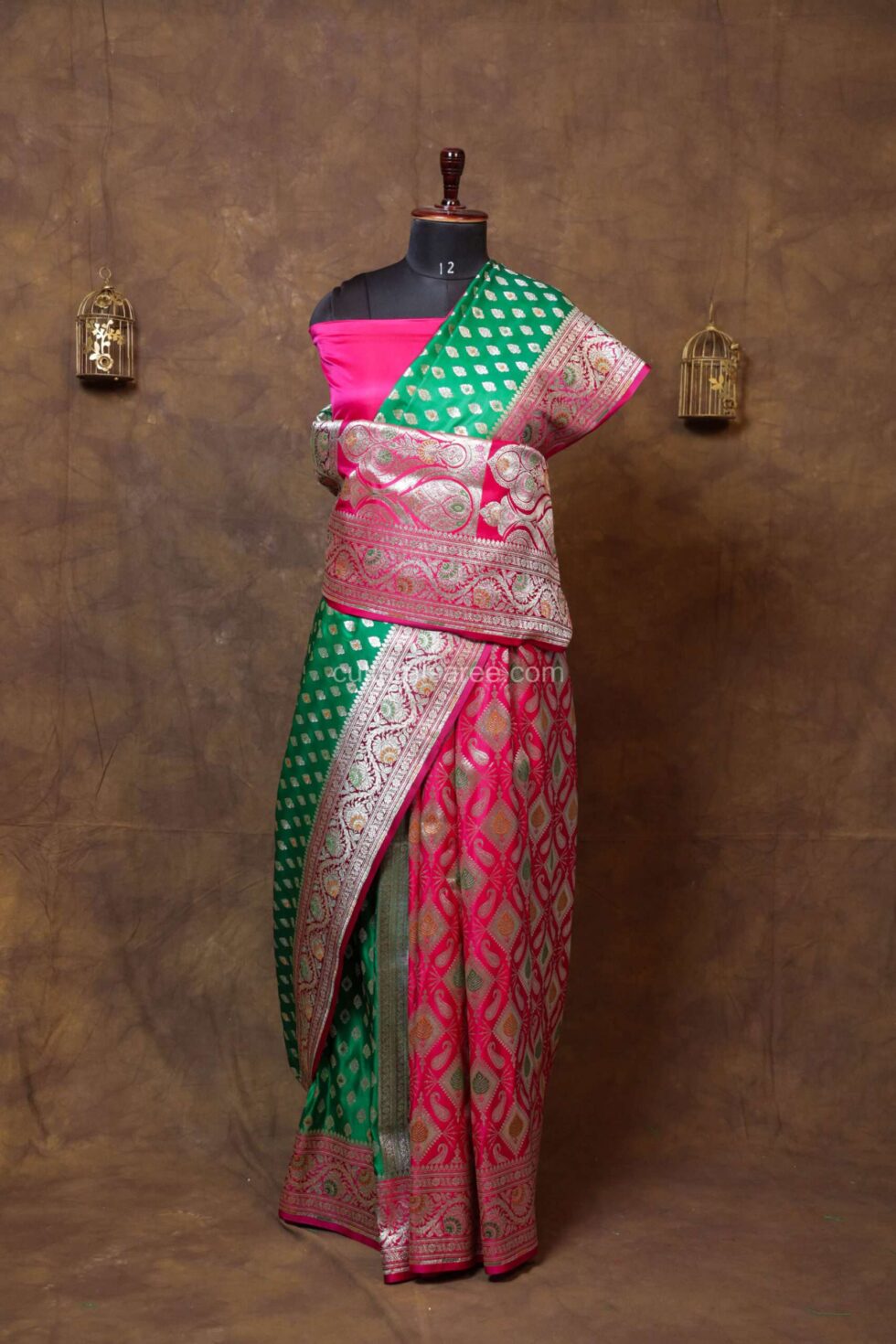 Green and pink banarasi satan saree with minakari work and floral buta motifs on achal and border