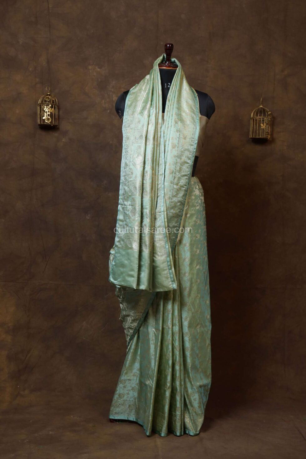 Mint green banarasi silk saree with silver border
